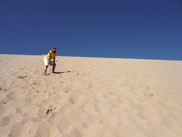 Karen Duquette almost to the top of the dune